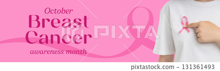 Individual highlights a pink ribbon for breast cancer awareness 131361493