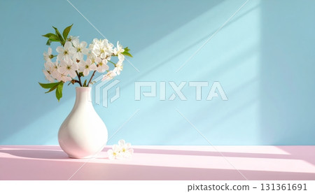 A beautiful spring bouquet of white flowers in a glass vase is a perfect still life decoration 131361691