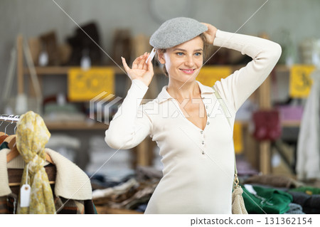 During November sales, european woman try on hat 131362154