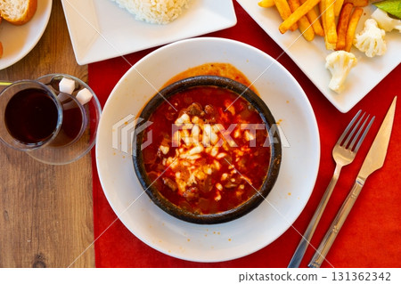 Portion of just cooked Osmanli kebab Portion of just cooked Osmanli kebab 131362342