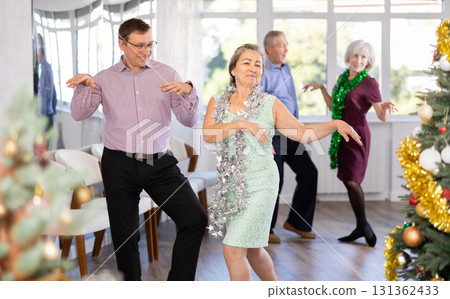 Adult man and elderly woman dance twist 131362433
