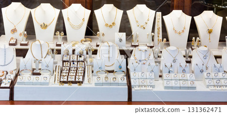 Semiprecious stones jewelry in showcase of shop 131362471