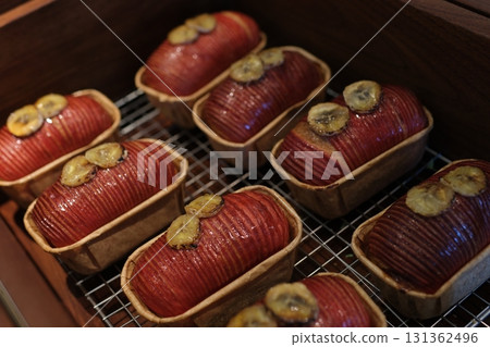 Loaf of apple nut bread with a red banana 131362496