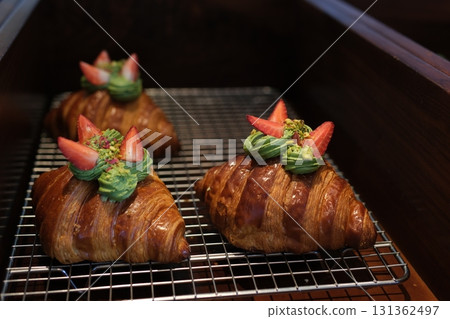 croissant with cream, strawberries, and blueberries 131362497