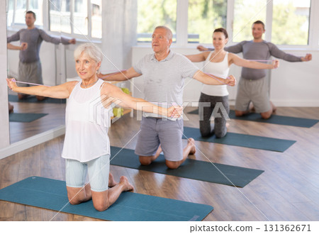 Elderly woman exercising with pilates loop 131362671