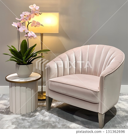 White chair with a pink cushion sits in front of a table 131362696