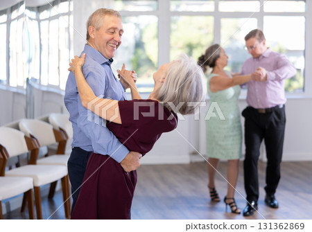 Senior man and elderly woman are dancing classic version of waltz in couple 131362869
