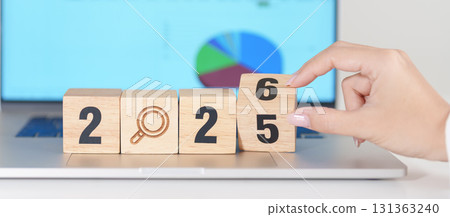 2025 end year to Happy New Year 2026 block with magnifying glass icon against laptop computer. SEO, Search Engine Optimization, hiring , Advertising, Strategy, marketing, Keyword, Content and New year 131363240