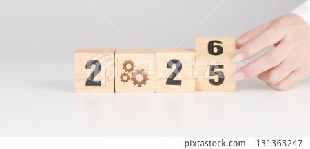 2025 year change to 2026 year block with gear icon. Business Process, Team, teamwork, Goal, Target, Resolution, strategy, plan, Action, motivation, change, brainstorm and New Year start concepts 2025 year change to 2026 year block with gear icon. Business Process, Team, teamwork, Goal, Target, Resolution, strategy, plan, Action, motivation, change, brainstorm and New Year start concepts 131363247