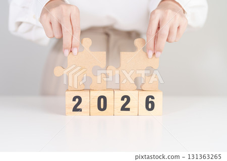 2026 year block with jigsaw puzzle icon. Business Process, Team, teamwork, Goal, mission, Resolution, strategy, plan, Action, partnership, and New Year start 131363265
