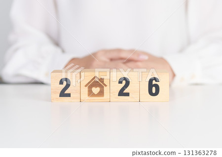 2026 with Home and Heart block. Property investment, House Mortgage, Real Estate tax, homeless, donation, Financial and happy family concepts 131363278