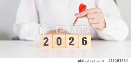 red dart with  chess people and 2026 year blocks.. Goal, plan, action, target, strategy, leadership, New Year and marketing concept 131363284