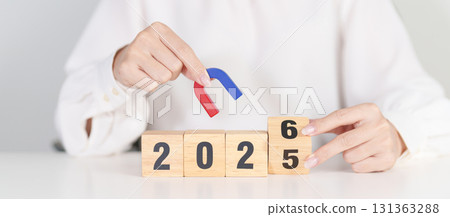 hand holding magnet over 2026 Year block. Human resource management, Recruitment, Teamwork, strategy, toxic people and leadership Concepts hand holding magnet over 2026 Year block. Human resource management, Recruitment, Teamwork, strategy, toxic people and leadership Concepts 131363288