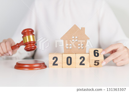 2025 end year to Happy New Year 2026 with small toy house model with gavel justice hammer on desk in courthouse. Real Estate Law, Home Insurance, property Tax, Auction and Bidding concepts 2025 end year to Happy New Year 2026 with small toy house model with gavel justice hammer on desk in courthouse. Real Estate Law, Home Insurance, property Tax, Auction and Bidding concepts 131363307