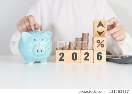 2025 to 2026 New year with percentage change to UP and Down arrow with coin stack. Interest rate, GDP, stocks market, financial, deflation and Inflation, mortgage, debt, Loan and Economic Recession 131363317