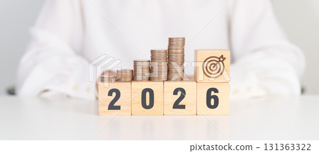 Happy New Year 2026 with Coins stack and dartboard icon. Strategy, goal, Money, Budget, tax, investment, financial, savings and New Year Resolution concepts Happy New Year 2026 with Coins stack and dartboard icon. Strategy, goal, Money, Budget, tax, investment, financial, savings and New Year Resolution concepts 131363322