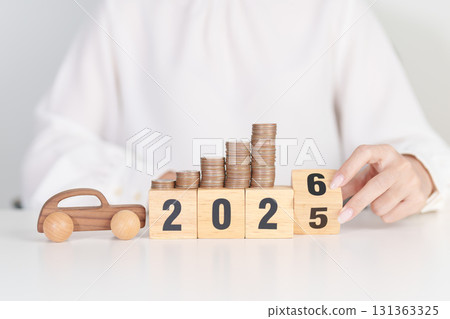 2025 end year to Happy New Year 2026 with car model and Coins Money stack for deposit and Automobile Tax. Money Saving, Car Insurance, Financial, vehicle Repair and Maintenance and New Year concept 131363325