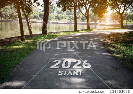 Scenic pathway at a park with the year 2026 and the word 'START' painted on asphalt, symbolizing new beginnings and outdoor motivation Scenic pathway at a park with the year 2026 and the word 'START' painted on asphalt, symbolizing new beginnings and outdoor motivation 131363658