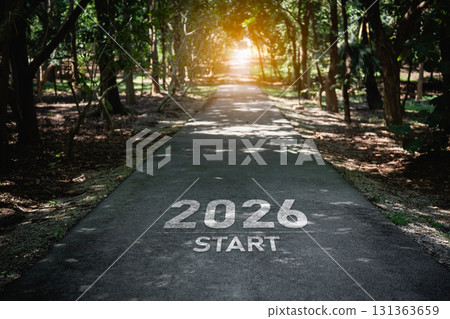 Inspirational Path with '2026 Start' Marking on Road Surrounded by Green Trees, Symbolizing Journey and Future Opportunities in Nature Inspirational Path with '2026 Start' Marking on Road Surrounded by Green Trees, Symbolizing Journey and Future Opportunities in Nature 131363659