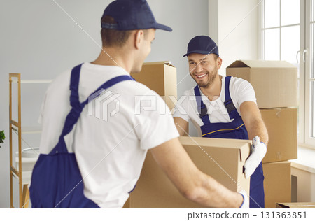 Two Movers Working on Home or Office Move with Cardboard Boxes 131363851