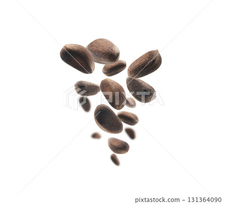 Pine nuts levitate on a white background 131364090