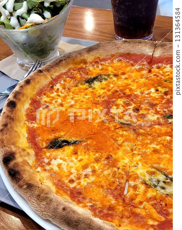 Hot and cheesy pizza slice with a crispy crust and savory toppings. A perfect mix of melty goodness and bold flavor for a satisfying comfort food favorite. Hot and cheesy pizza slice with a crispy crust and savory toppings. A perfect mix of melty goodness and bold flavor for a satisfying comfort food favorite. 131364584