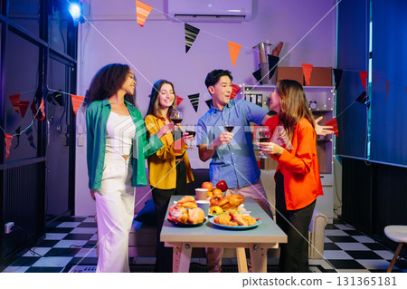 Celebration with friends enjoying food, drinks, and laughter at a lively house party. Celebration with friends enjoying food, drinks, and laughter at a lively house party. 131365181