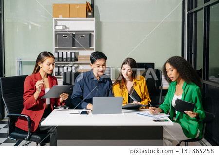Multiracial group of young creative people in smart casual wear discussing business brainstorming meeting ideas design project. Multiracial group of young creative people in smart casual wear discussing business brainstorming meeting ideas design project. 131365258