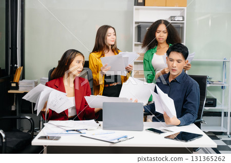Diverse teams celebrating success in a lively office setting, capturing moments of joy, teamwork 131365262