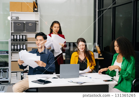 Diverse teams celebrating success in a lively office setting, capturing moments of joy, teamwork 131365265