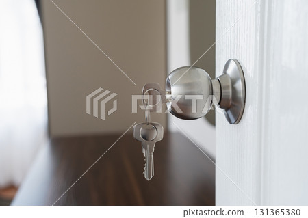 Close-Up of Modern Door Knob with Key Inserted, Soft Focus on Key and Door, Contemporary Interior Design Element, Home Security Concept 131365380