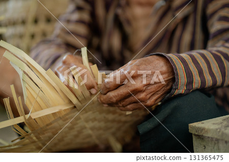Traditional Craft Skilled and Artisanal Basket Weaving by Experienced Hands in Communities 131365475