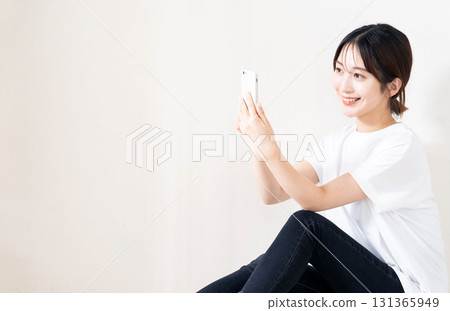 A woman using a smartphone 131365949