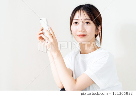 A woman using a smartphone 131365952