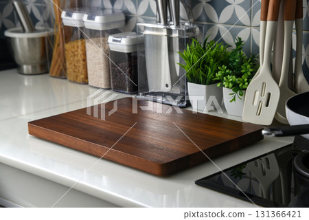 Modern kitchen countertop with blank wooden cutting board Modern kitchen countertop with blank wooden cutting board 131366421