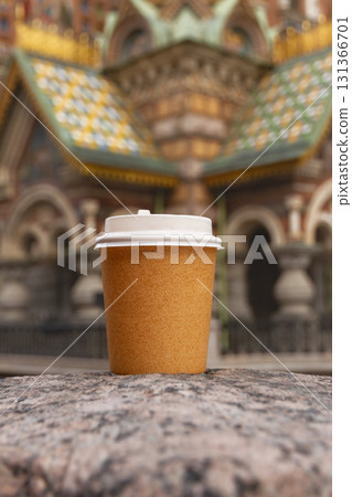 paper cup of drink on bridge in St. Petersburg, Russia on sunny day paper cup of drink on bridge in St. Petersburg, Russia on sunny day 131366701