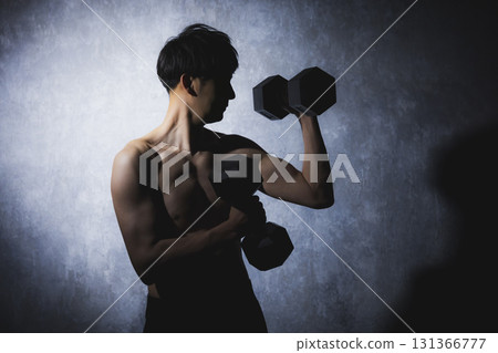 Men doing muscle training with dumbbells 131366777