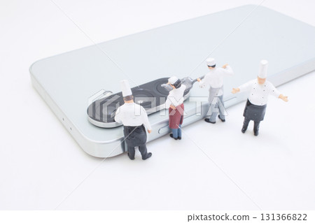 Miniature Chef Team Assembles On a Smartphone To Showcase Miniature Chef Team Assembles On a Smartphone To Showcase 131366822