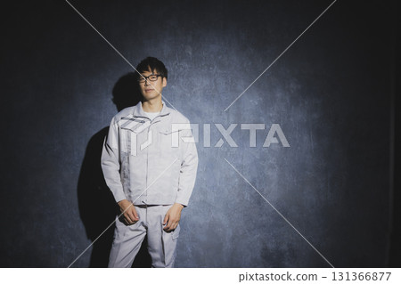 Men in work clothes with arms folded Men in work clothes with arms folded 131366877