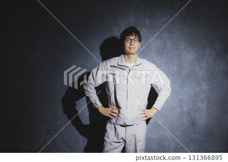 Men in work clothes with arms folded 131366895