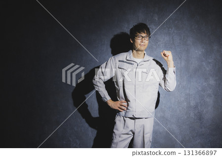 Men in work clothes with arms folded 131366897