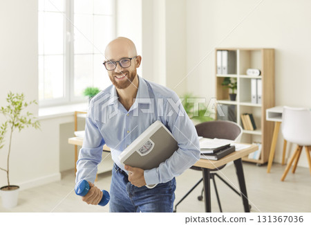 Active Businessman Portrait With Dumbbells In Office For Workout 131367036