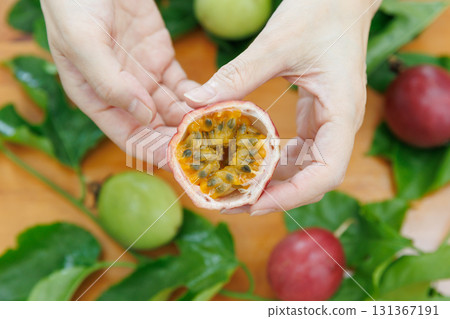 Hand holding passion fruit 131367191