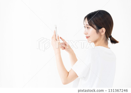 A woman using a smartphone 131367246