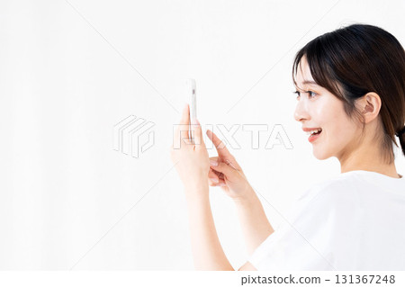 A woman using a smartphone 131367248