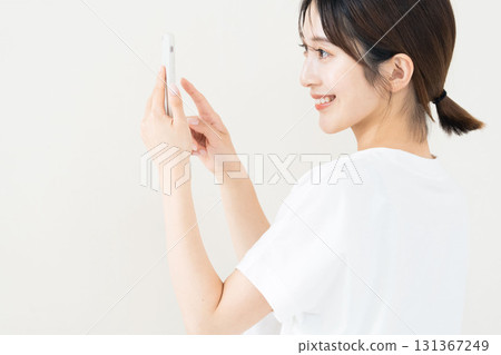 A woman using a smartphone 131367249