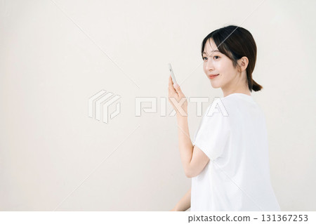 A woman using a smartphone 131367253