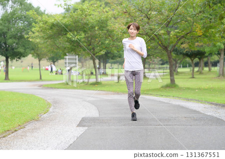Two women running in the park Two women running in the park 131367551