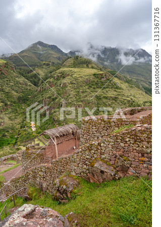 Ancient Inca ruins of Pisac nestled in the Andean mountains, Peru 131367716