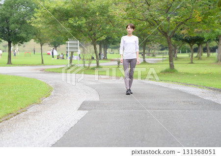 Two women running in the park Two women running in the park 131368051